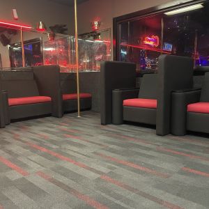 nightclub booths for private dance black and red located in a gentlemen's club
