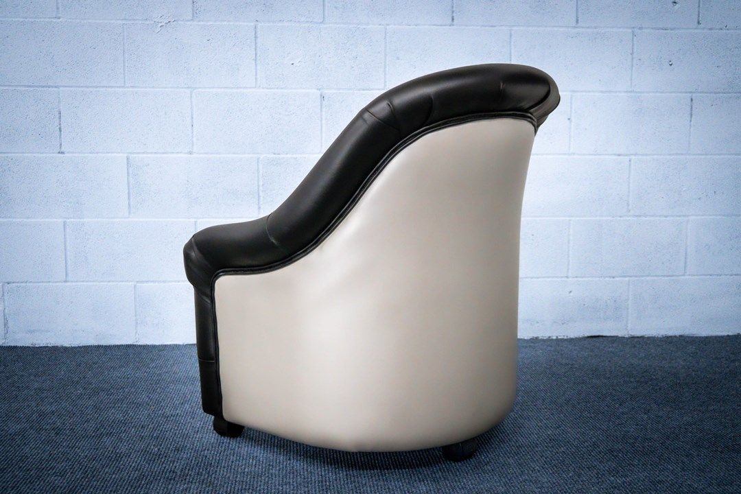Black and cream vinyl barrel chair