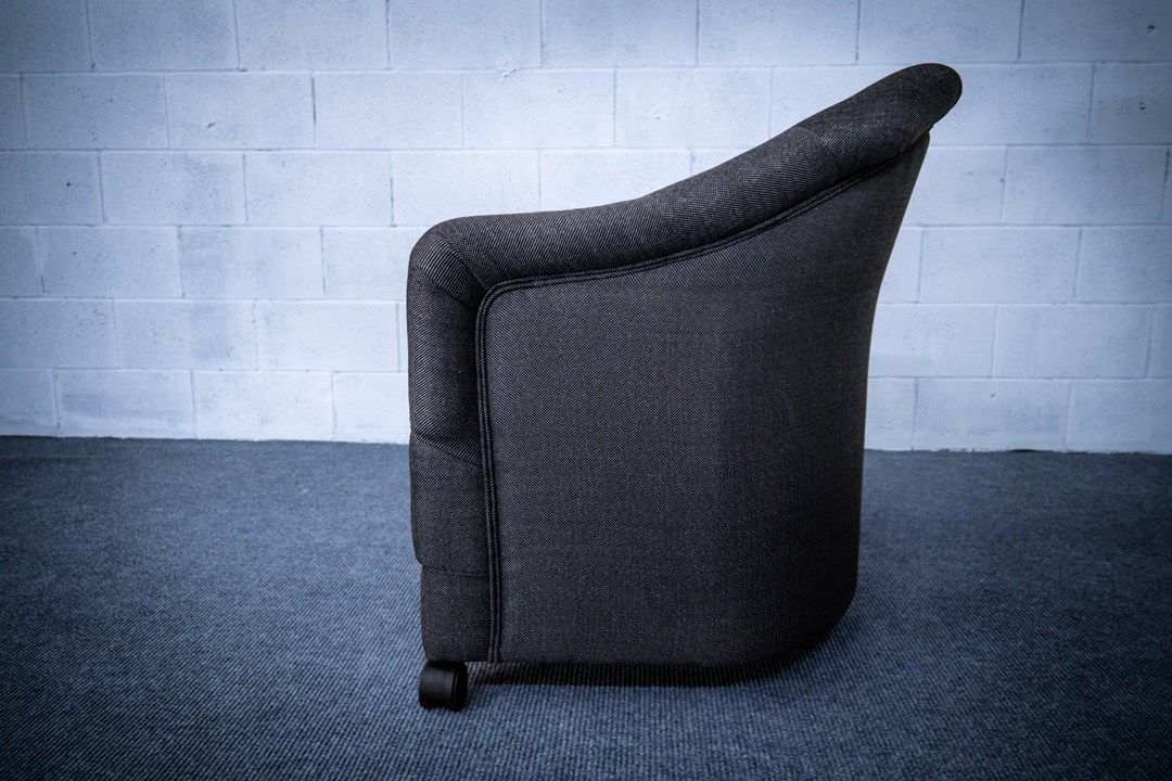 Barrel chair in gray fabric side view
