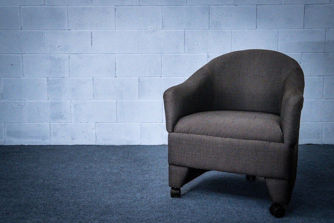 Barrel chair in gray fabric for nightclub